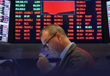 Dow Flips over 500 points as COVID-19 fears rise